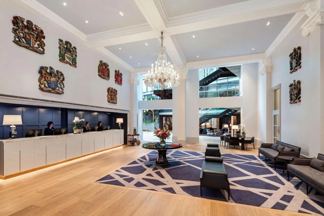 Hotel lobby with waiting area and chandelier at The Edwardian Manchester on Peter Street