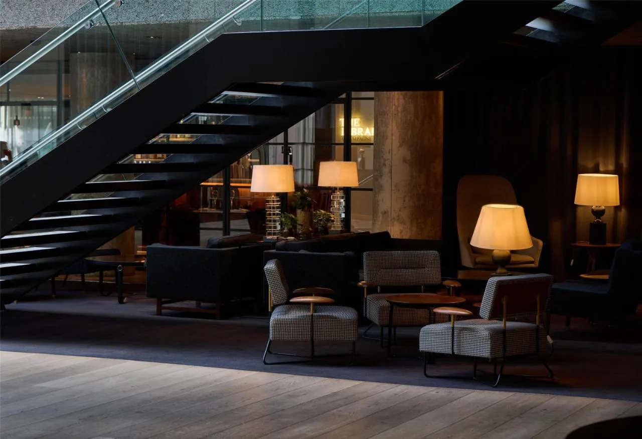 Lobby seating area and staircase at The Edwardian Manchester in Manchester city centre