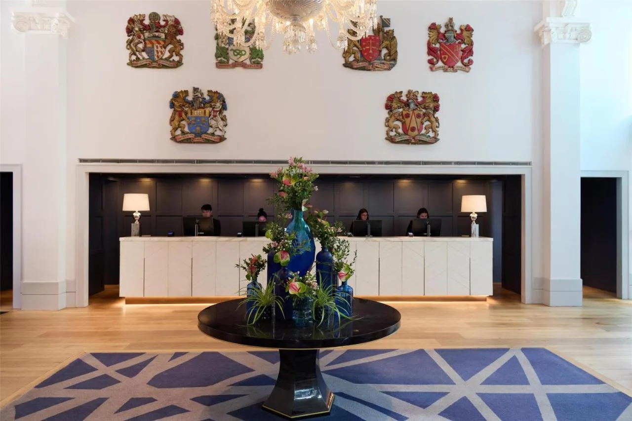 Reception table with flowers at The Edwardian Manchester, A Radisson Collection Hotel